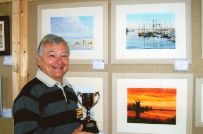 Dave France our programme organiser with the cup for winning the best picture at our exhibition.