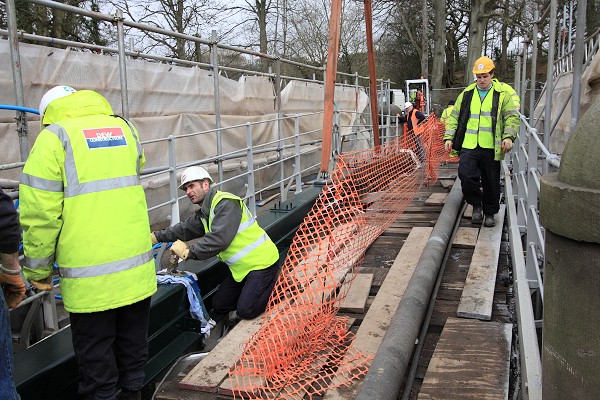 The SHS containing the new gas main being manoeuvred into final position