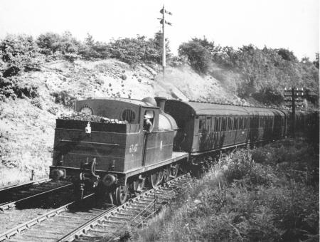 Ex.-G.C. 4-4-2 C13 suburban tank No.67401 brings a Macclesfield-Manchester train round the curve towards Marple wharf Junction in 1956.