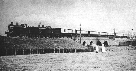 The Royal Train conveying King Edward VII and Queen Alexandra, passing Bredbury Station (extreme right) on 12th July, 1905.