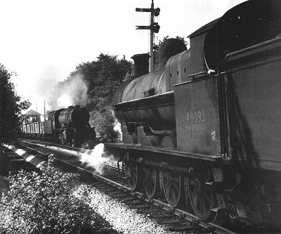 New and old steam locomotives meet at Marple Wharf Junction in August 1956.