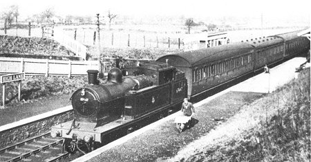 High Lane just after Nationalisation. Ex G.C. C.14 4.4.2T No 67447 arrives with the 1035 Manchester London Road - Macclesfield Central train on 1st March 1951. Note the small waiting-cumbooking hall on the Down Platform. (R. Gee) (From Marple Rail Trails)