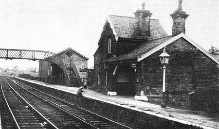 Strines - a typical Midland Railway style small country station, with fine gas lamps, neat stone buildings and a large wooden goods shed, c 1962.